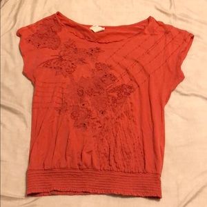 Orange cinched bottom shirt